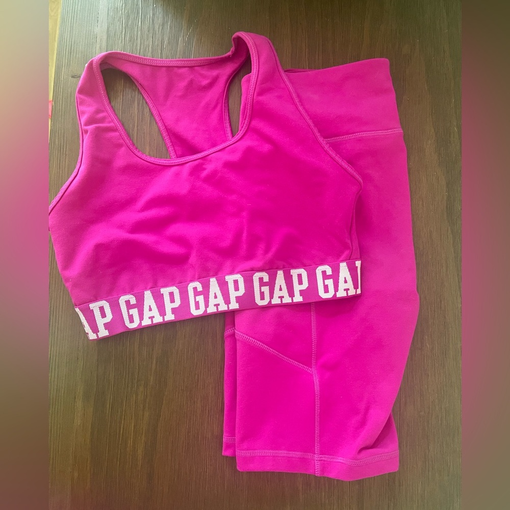 Matching pink athletic work out set sports bra and high rise bike shorts